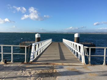 Pier over sea against sky
