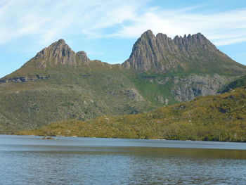 Scenic view of lake and mountains against sky