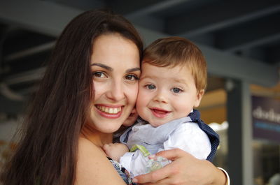 Portrait of happy smiling woman with son