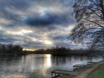 Scenic view of lake against sky during sunset