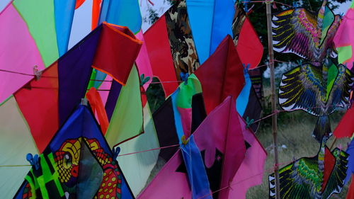 Low angle view of flags hanging on building