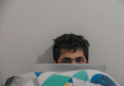 Portrait of young man holding camera