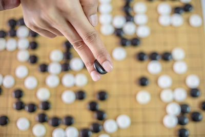 Cropped hand playing japanese checkers