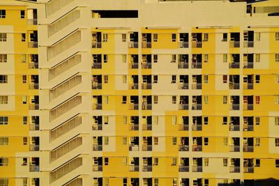 Low angle view of yellow residential building