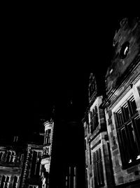 Low angle view of illuminated buildings at night