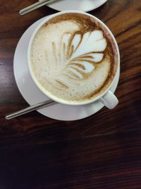 High angle view of cappuccino on table