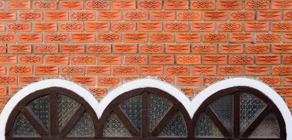 Low angle view of brick wall in building