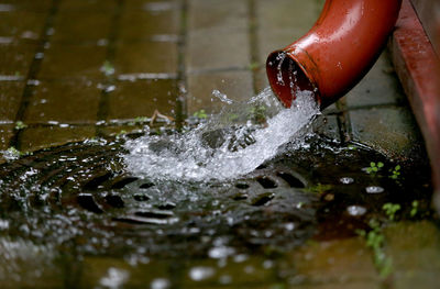 Midsection of person splashing water