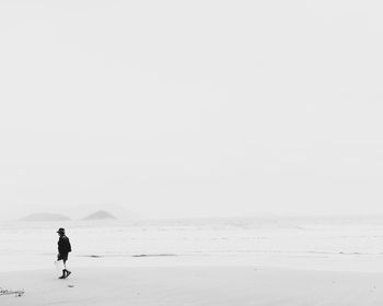 Woman standing on beach