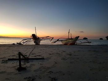 Scenic view of beach against sky during sunset