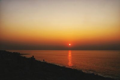 Scenic view of sea at sunset