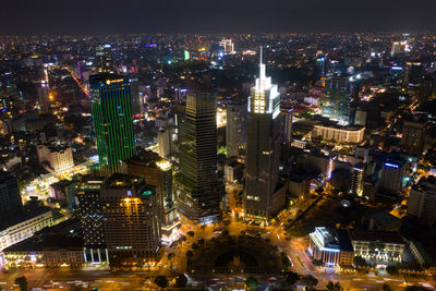 High angle view of illuminated buildings in city at night