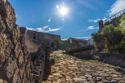 Old building against sky on sunny day