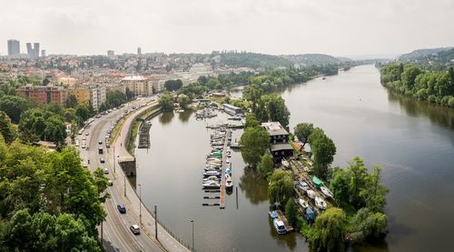 High angle view of river amidst trees in city