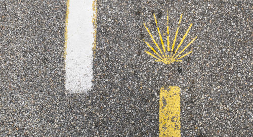 Close-up of yellow lines on road