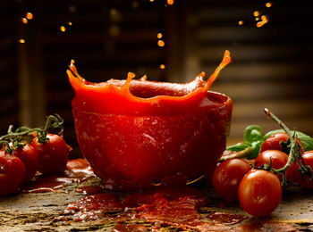 Close-up of red chili peppers on table