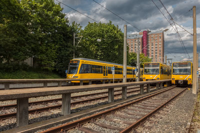 Train on railroad track against sky
