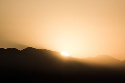 Scenic view of mountains at sunset