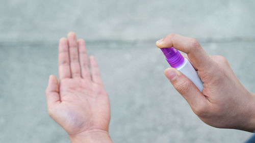 Close-up of hands holding sea against blurred background