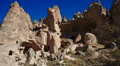 Low angle view of rock formation against sky