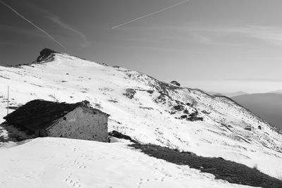 Scenic view of snow covered mountain against sky