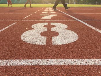 Low section of people on running track