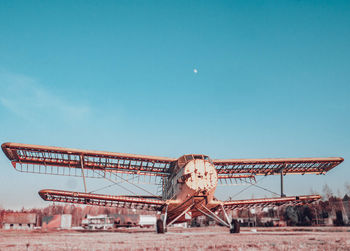 Low angle view of old construction site against clear blue sky