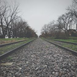 Surface level of railroad track against clear sky