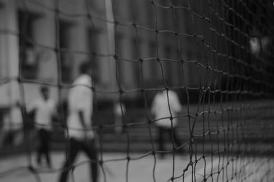 Full frame shot of people on fence