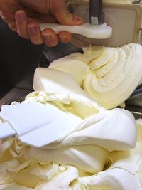 Close-up of hand holding ice cream