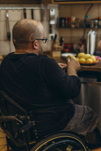 Side view of man using laptop