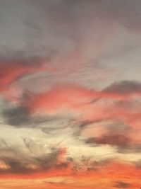 Low angle view of dramatic sky during sunset