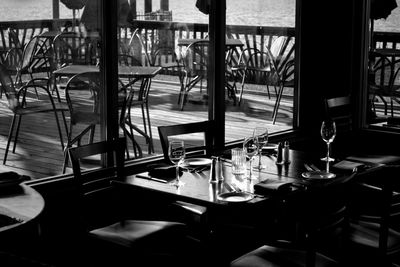 Empty chairs and tables in restaurant