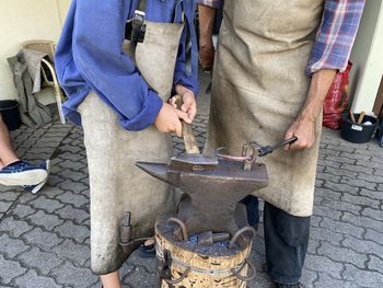 Low section of man working on street