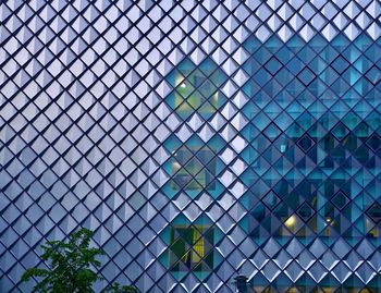 Full frame shot of building seen through chainlink fence