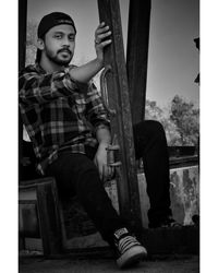 Portrait of boy sitting outdoors