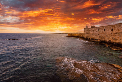 Scenic view of sea against sky during sunset