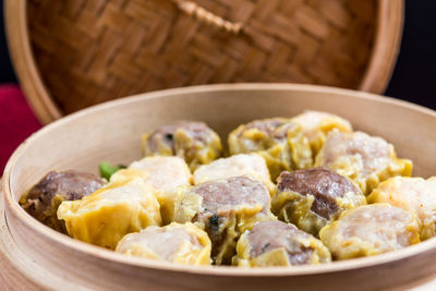 Close-up of chinese dumplings in bamboo basket