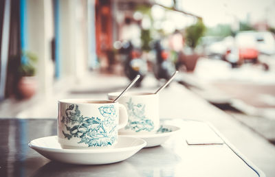 Close-up of coffee cup on table