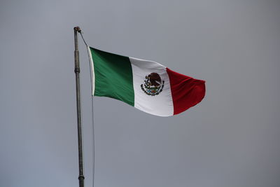 Low angle view of flag against sky