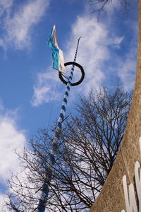 Low angle view of bare tree against blue sky