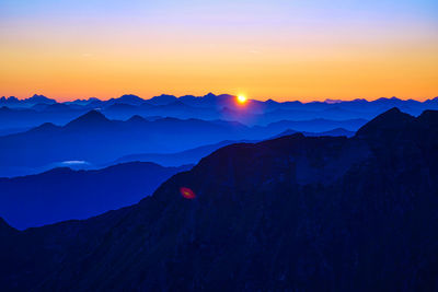 Scenic view of mountains against sky during sunset