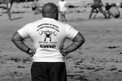 Rear view of a man standing outdoors