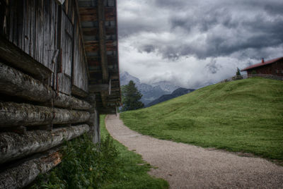 Empty road along countryside landscape