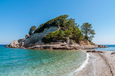 Scenic view of sea against clear blue sky