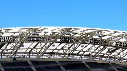 Low angle view of building against clear blue sky