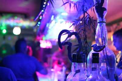 Close-up of wine bottles against blurred background