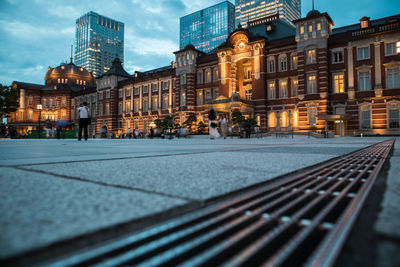 Buildings in city at dusk