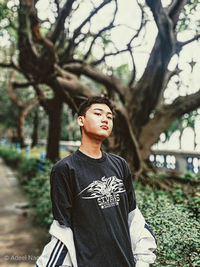 Full length of young man looking away