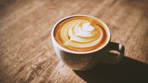 High angle view of cappuccino on table